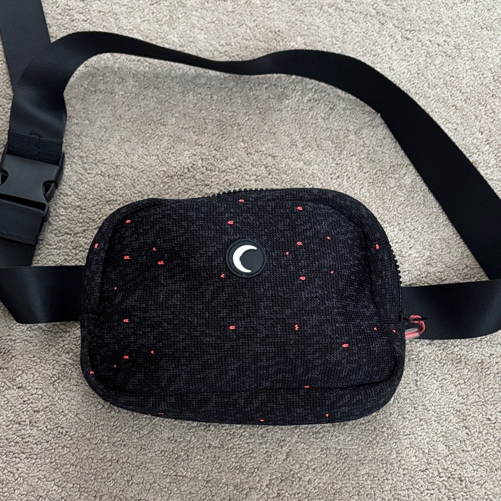 Stylish Black Crossbody Bag with Red Details